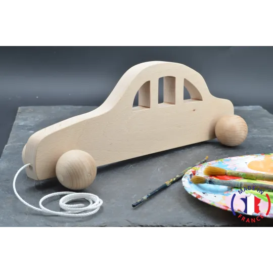 Race car made of raw wood to pull