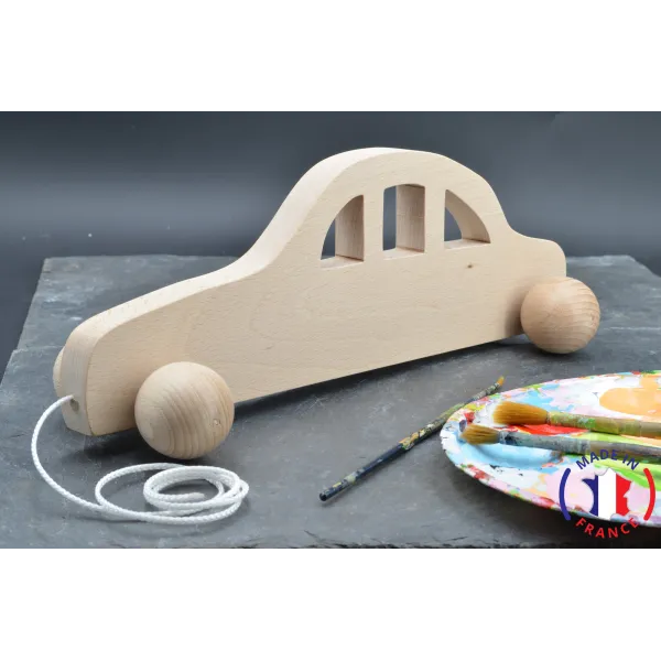 Race car made of raw wood to pull