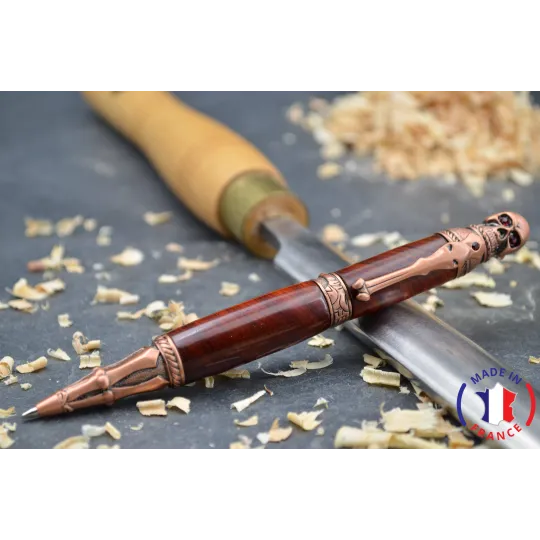 Skull wood pen made of violet wood.