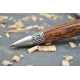 Stylo bille Merlin en bois de palmier rouge.